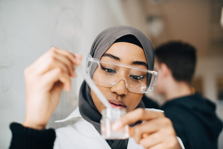 Female student wearing hijab doing scientific research