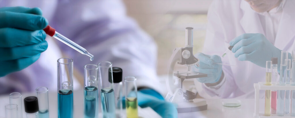 Laboratory concept; Scientist uses a dropper to transfer chemical reagent to test tube. He observes the chemical reaction with a blurred background of research in the laboratory
