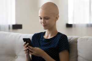 Person with alopecia areata using the phone there are There are NAAF Telephone Support Contacts around the world.